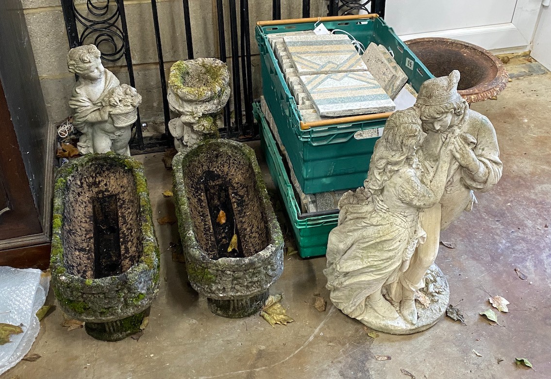 A small pair of rounded rectangular garden planters, a bird bath and two garden figures